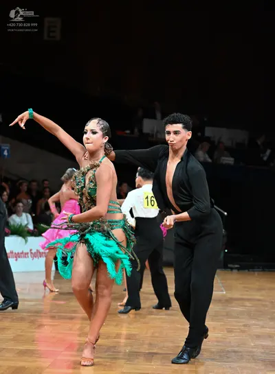 Dancesport competitor #16: Female dancer: green latin dress with sequins, embellishments, and fringe