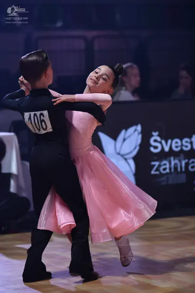 Dancesport competitor: Male dancer: black long-sleeved top and trousers