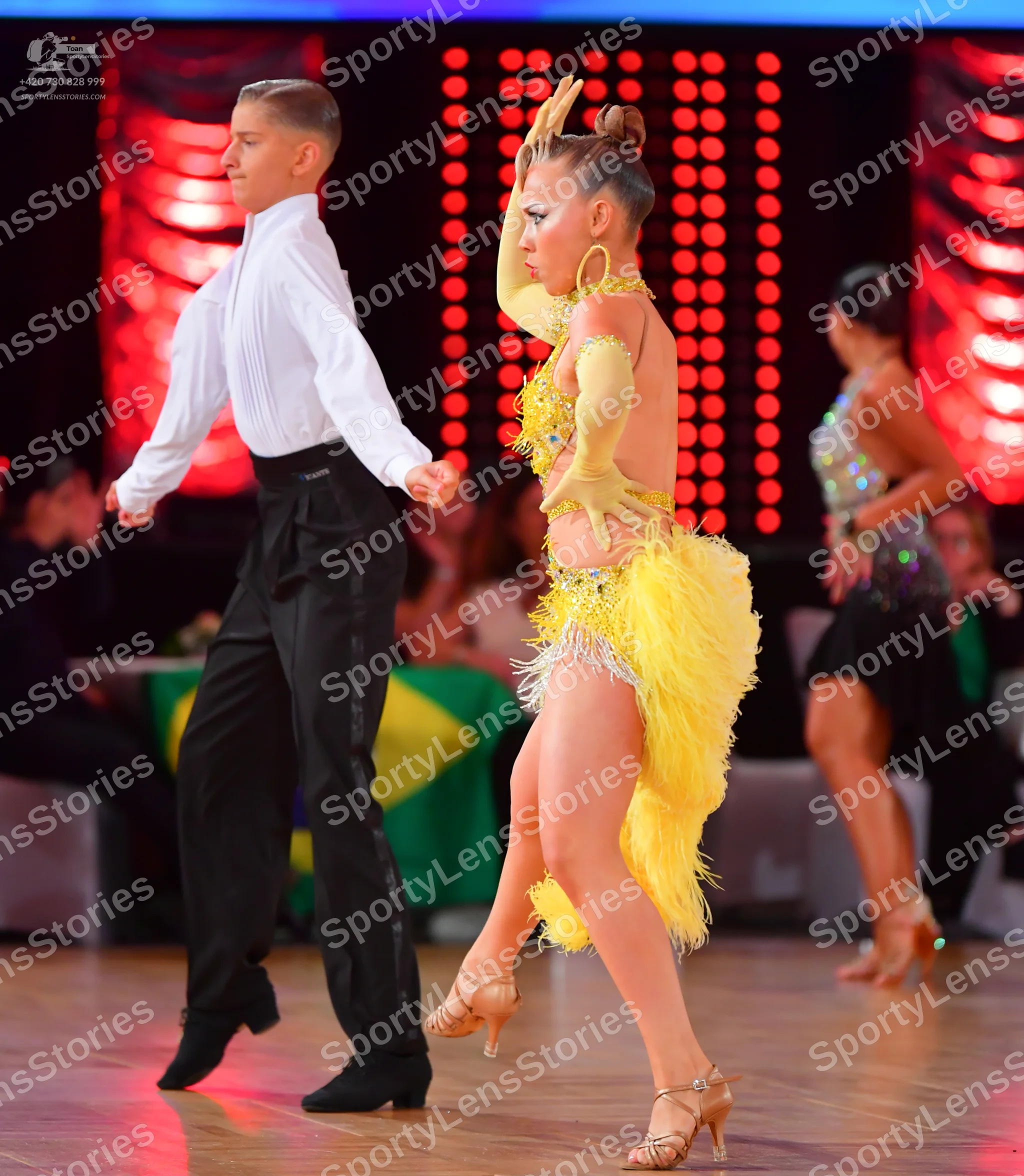 Dancesport competitor: Male dancer: white long-sleeved shirt and black trousers