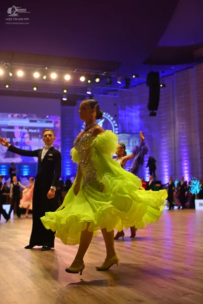Dancesport competitor: Male dancer: black suit, white shirt, and black bowtie