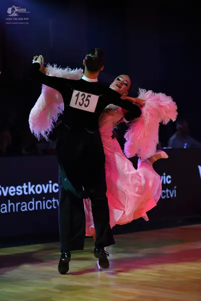 Dancesport competitor: Male dancer: black suit with a white collar