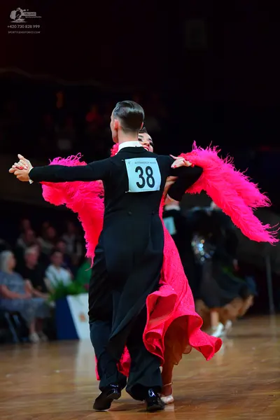Dancesport competitor #38: Male dancer: black suit with a white shirt and black bow tie