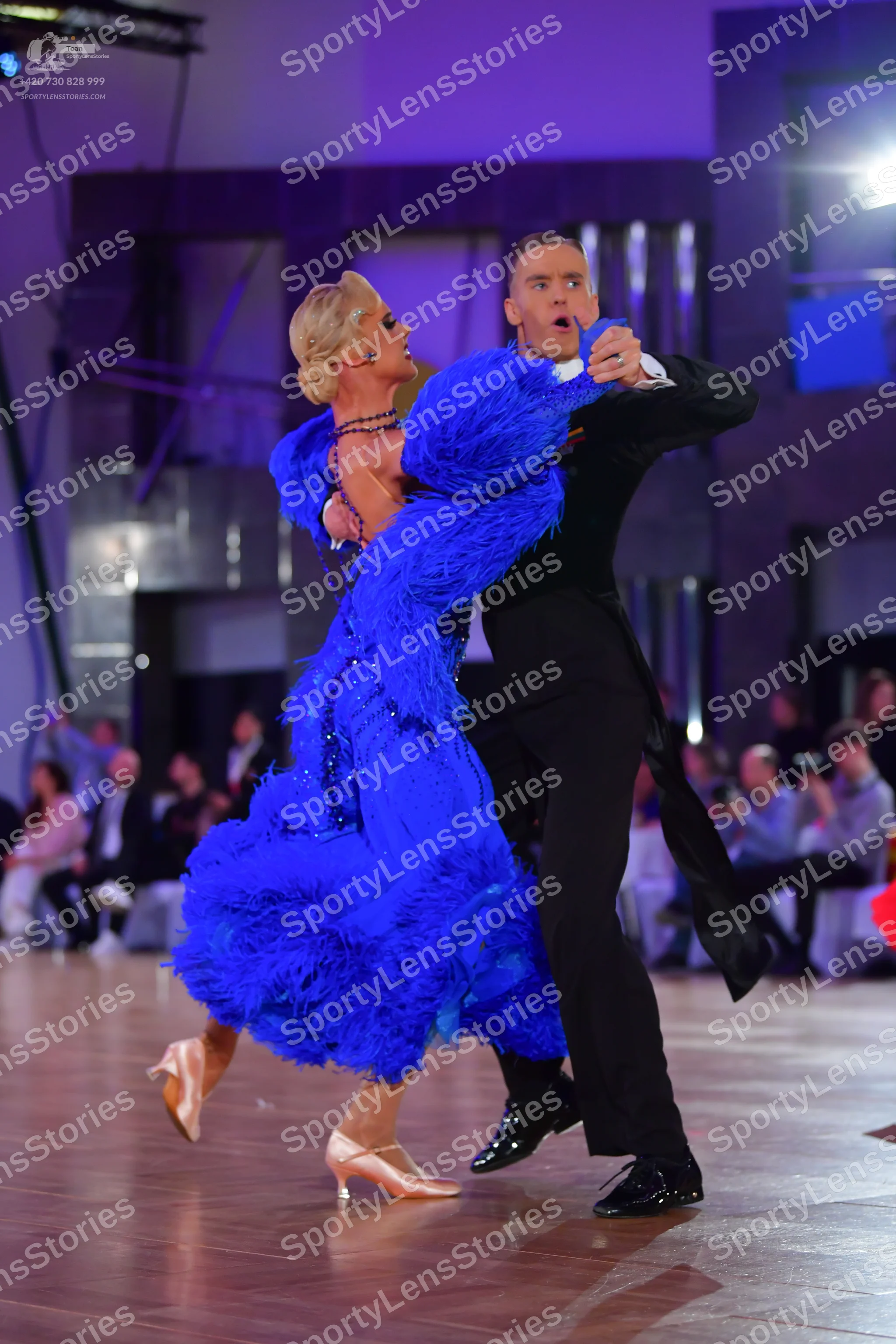 Dancesport competitor: Female dancer: royal blue feathered latin dress