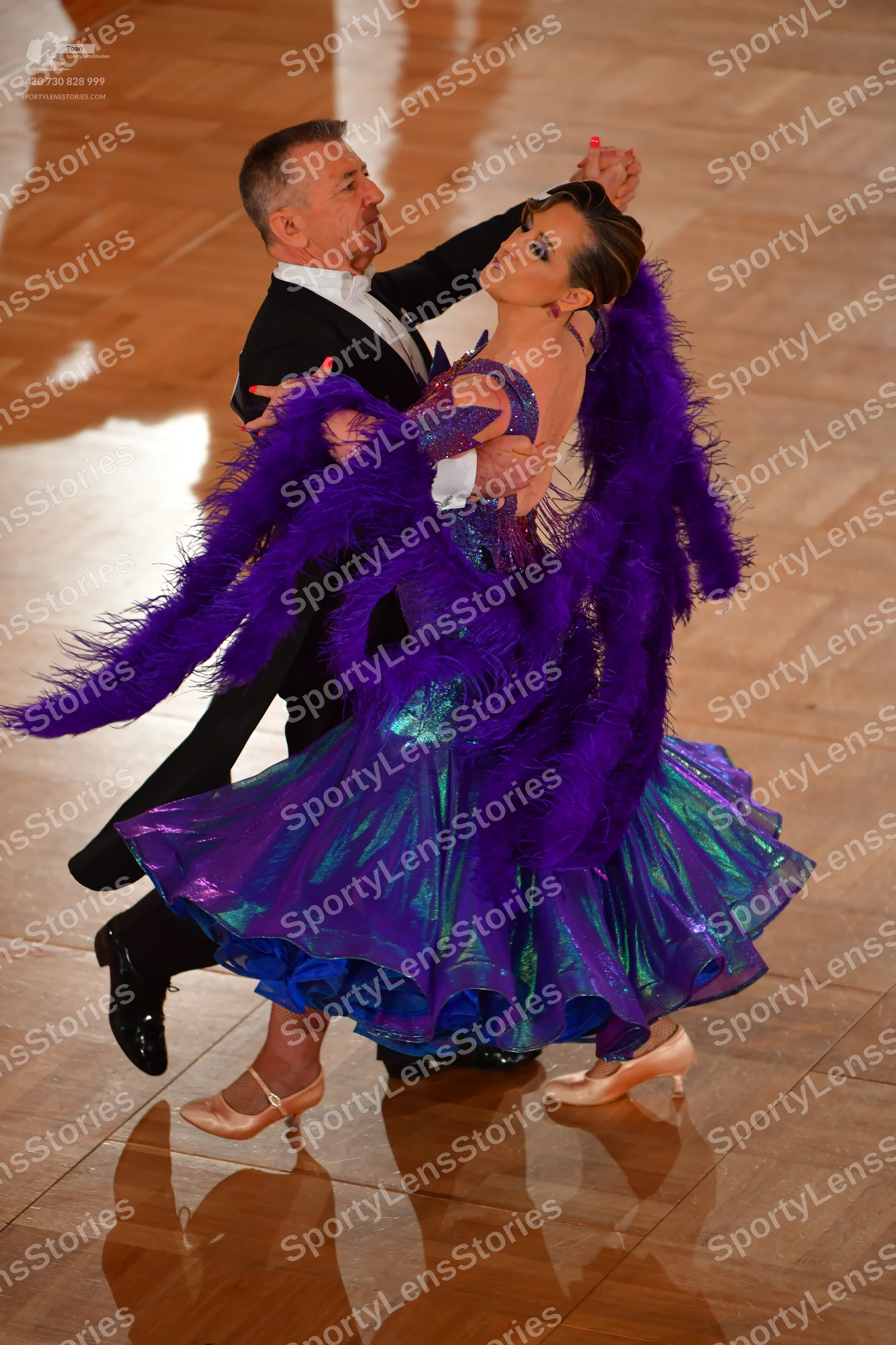 Dancesport competitor: Male dancer: black suit with a white shirt