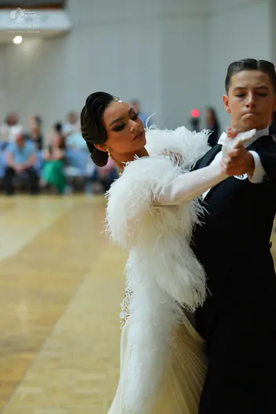 Dancesport competitor: Male dancer: black suit