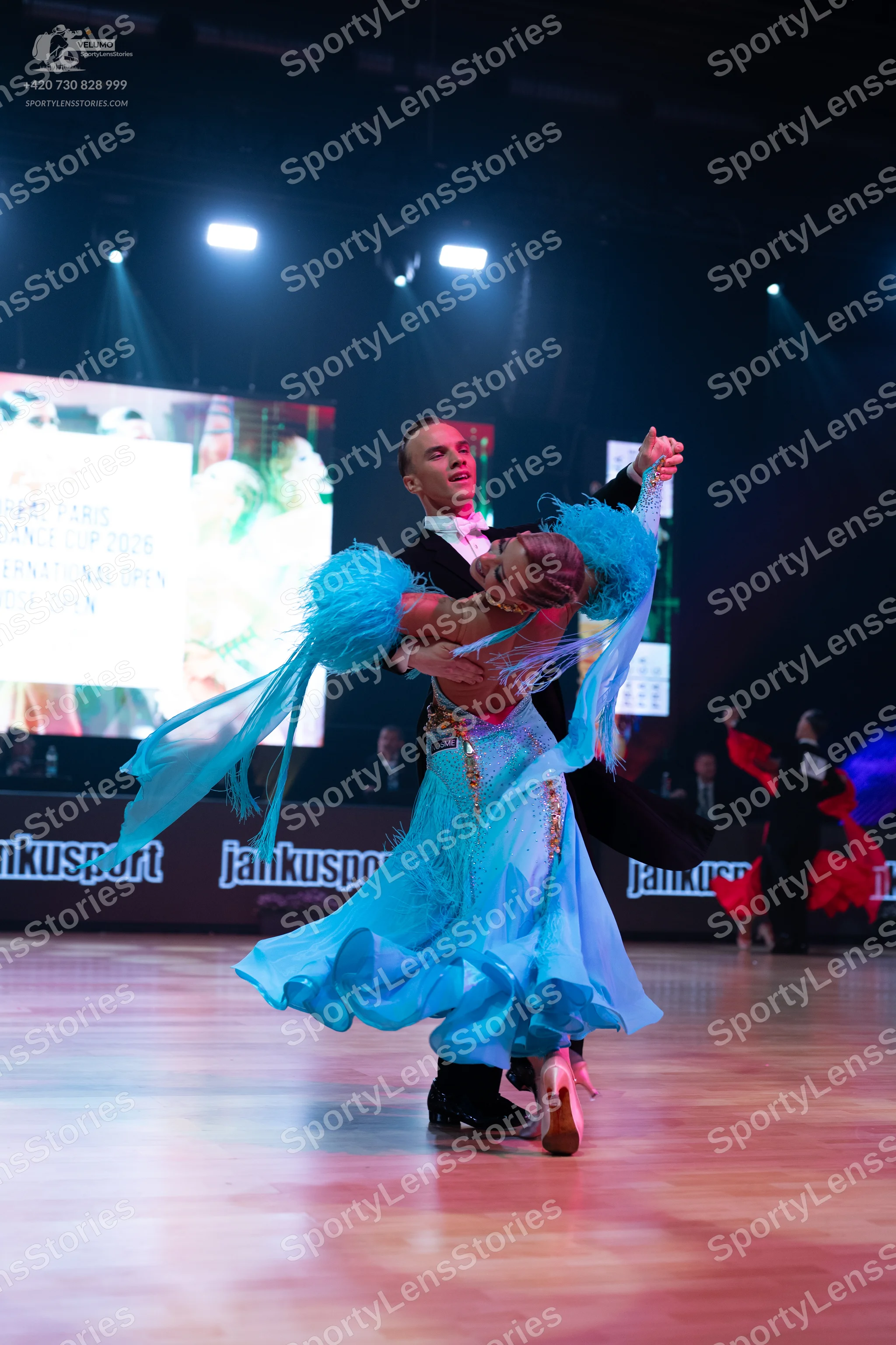 Dancesport competitor: Male dancer: black suit with a white shirt and white bow tie