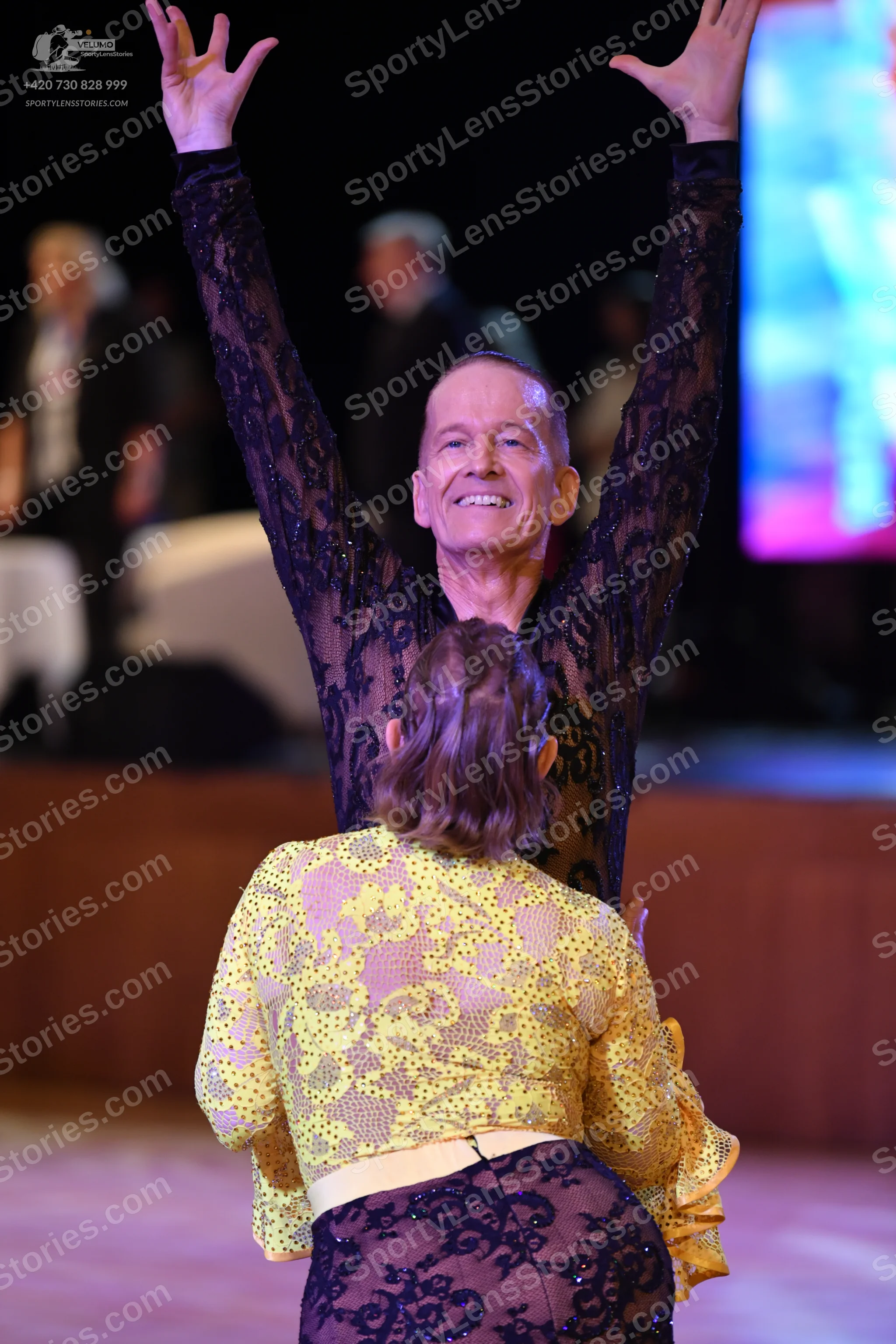 Dancesport competitor: Male dancer: black sheer/lace long-sleeved top