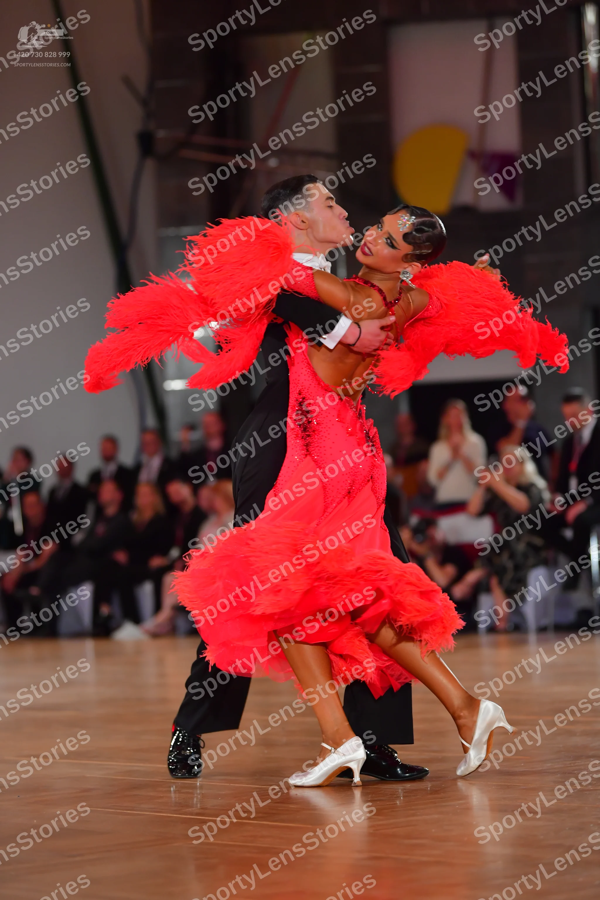 Dancesport competitor: Male dancer: black suit, white shirt, and black bow tie