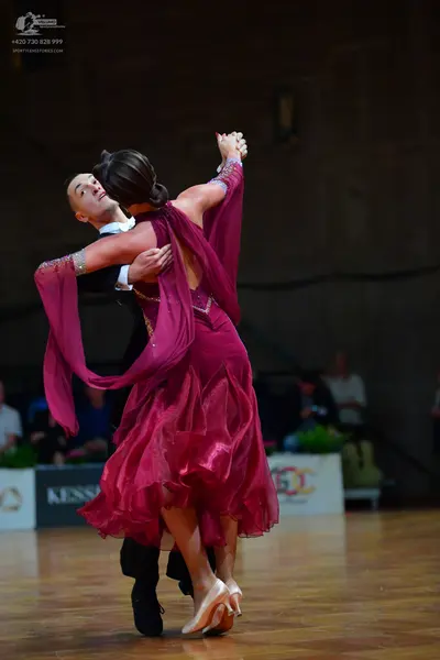 Dancesport competitor: Male dancer: black suit