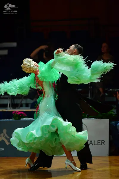 Dancesport competitor: Male dancer: black suit