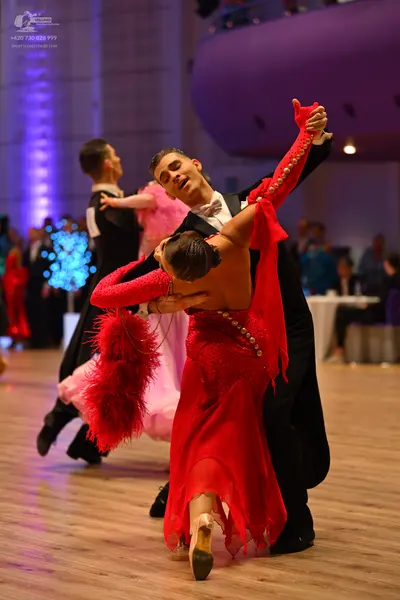 Dancesport competitor: Male dancer 1: black suit and white shirt