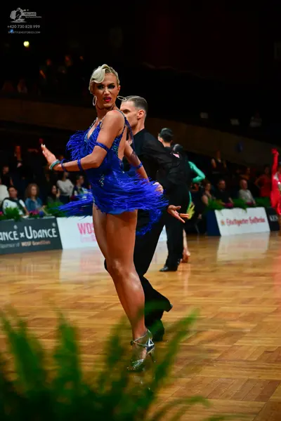 Dancesport competitor: Female dancer: royal blue latin dress with fringe
