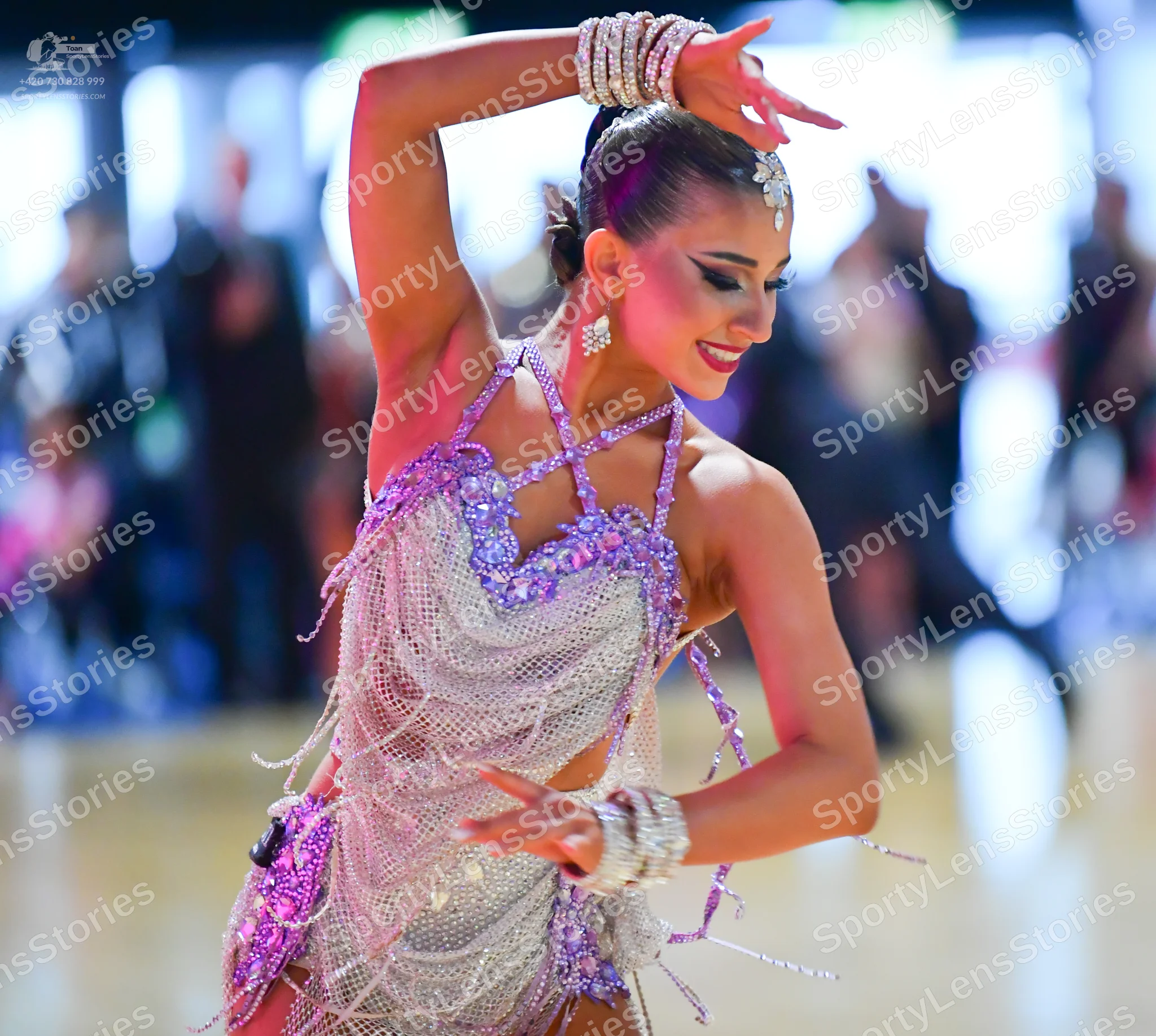 Dancesport competitor: Female dancer: silver/lavender latin dance dress heavily embellished with sequin