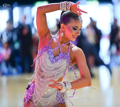 Dancesport competitor: Female dancer: silver/lavender latin dance dress heavily embellished with sequin