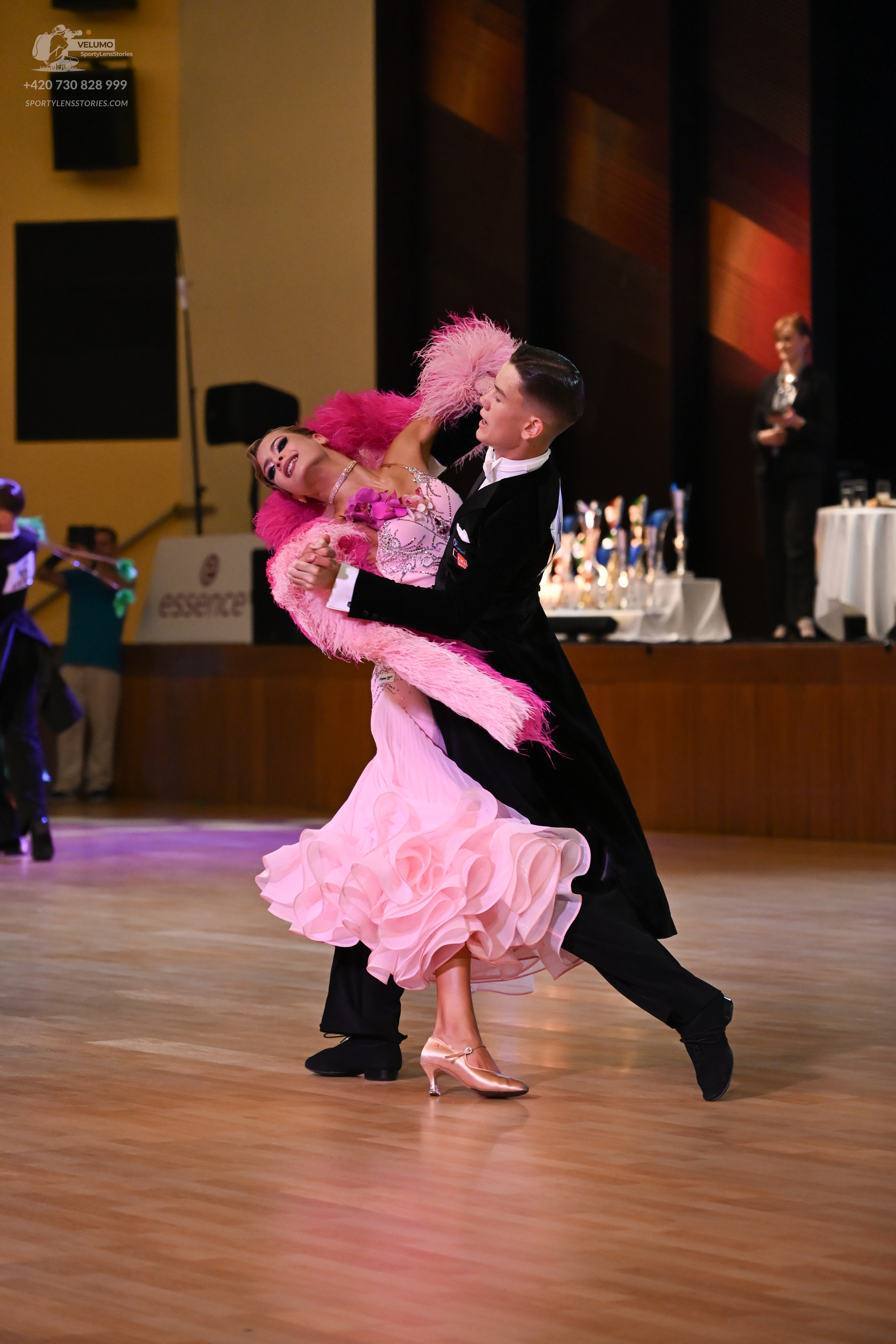 Dancesport competitor: Male:** Black tailsuit with a subtly sequined lapel detail
