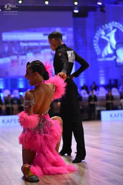 Dancesport competitor: Male dancer: black long-sleeved shirt and black trousers