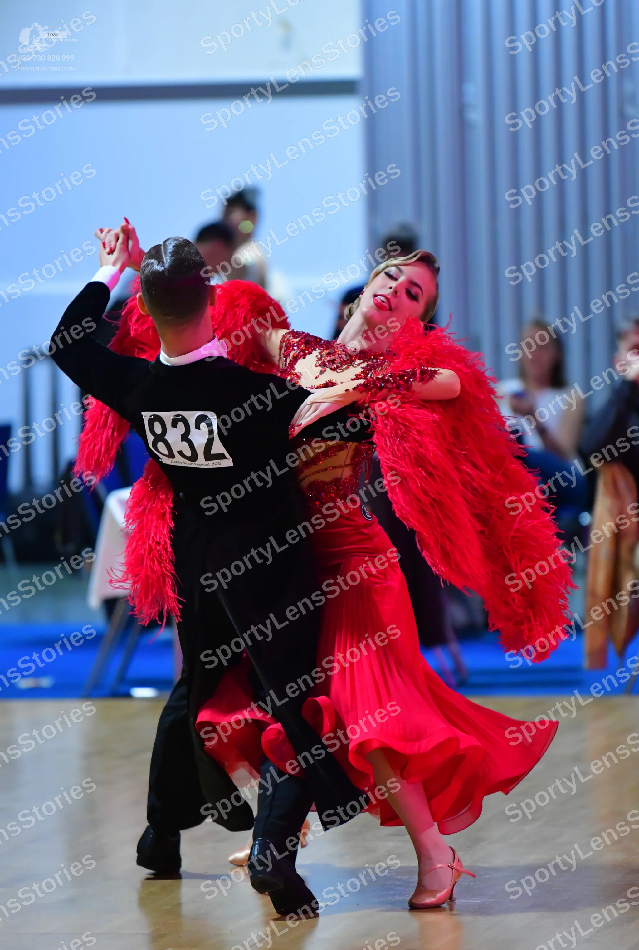 Dancesport competitor #832: Male dancer: black long-sleeved top with a white collar