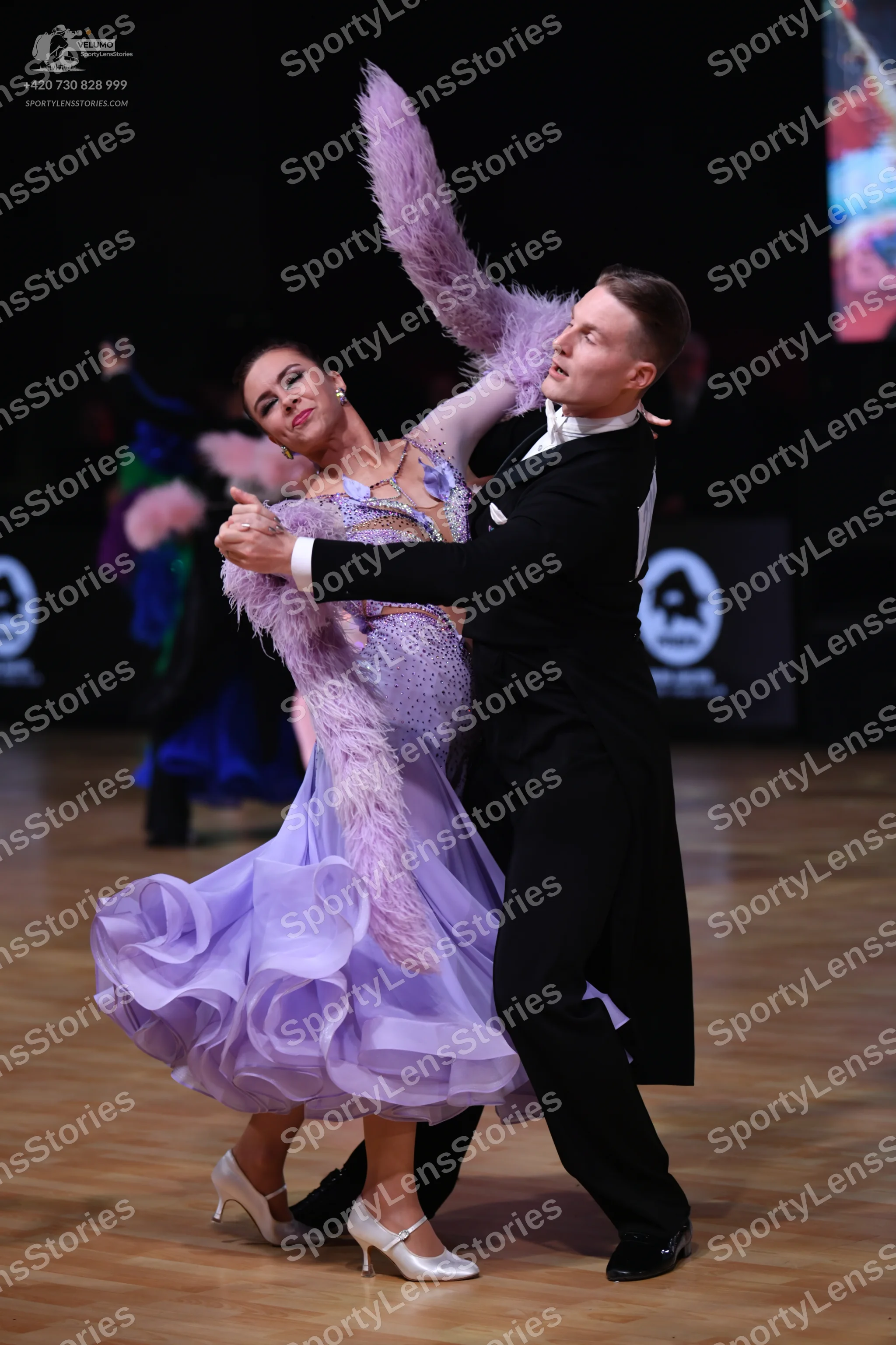 Dancesport competitor: Male dancer: black tailcoat with a white shirt and white bow tie