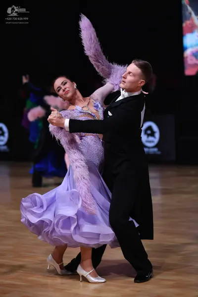 Dancesport competitor: Male dancer: black tailcoat with a white shirt and white bow tie