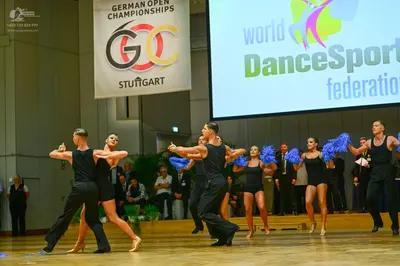 Dancesport competitor: Male dancers: black sleeveless tops and black trousers