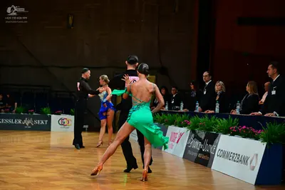 Dancesport competitor #48: Male dancer (foreground): black dance suit