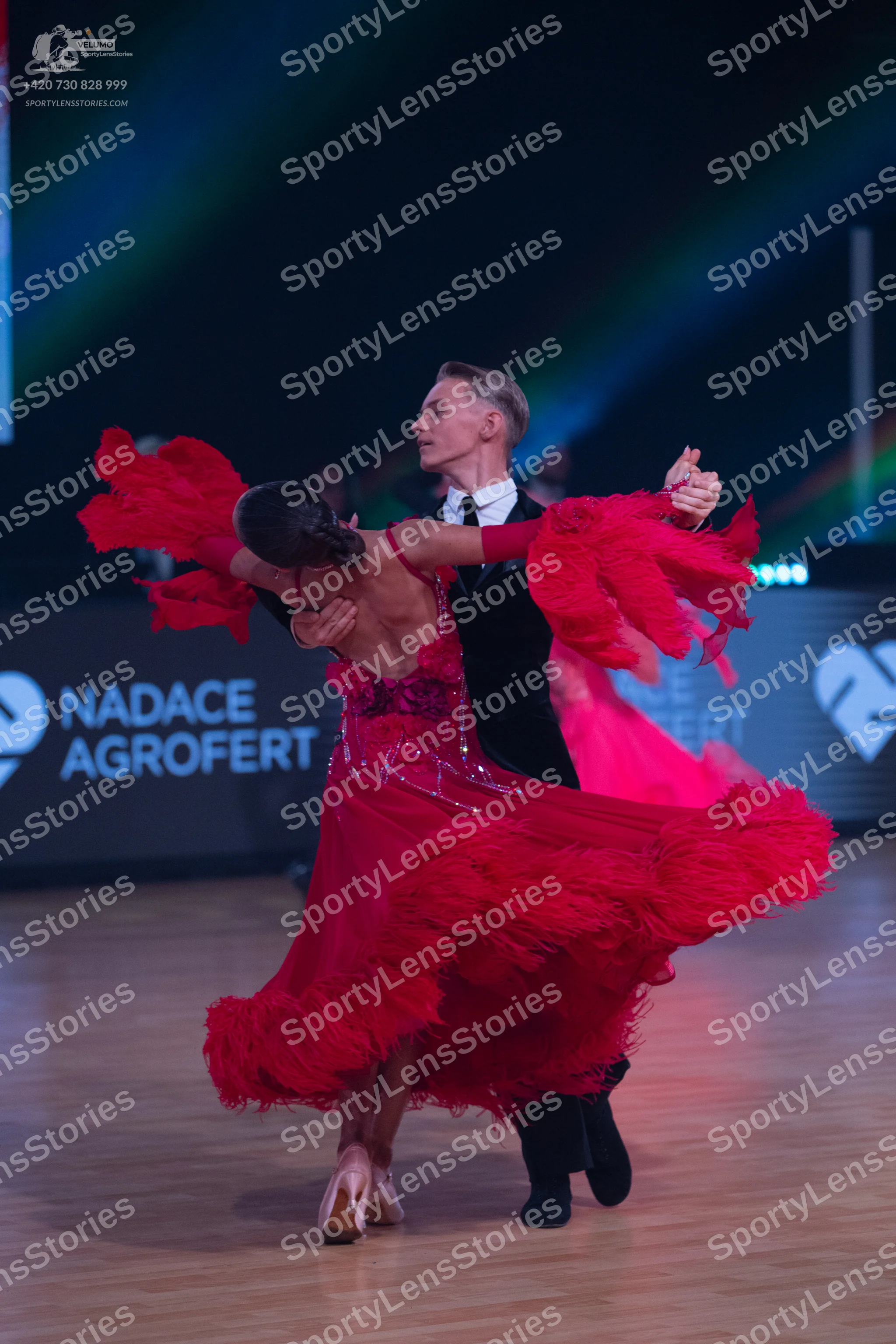 Dancesport competitor: Male dancer: black suit with a white shirt and black tie