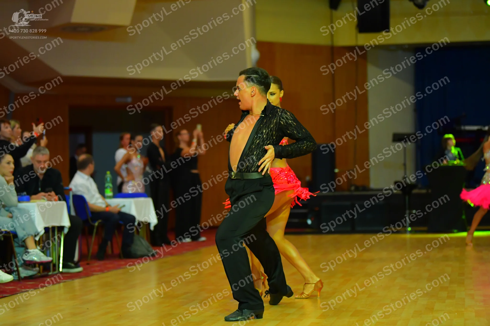 Dancesport competitor: Male dancer: black long-sleeved shirt with subtle sequins and black dance trouse