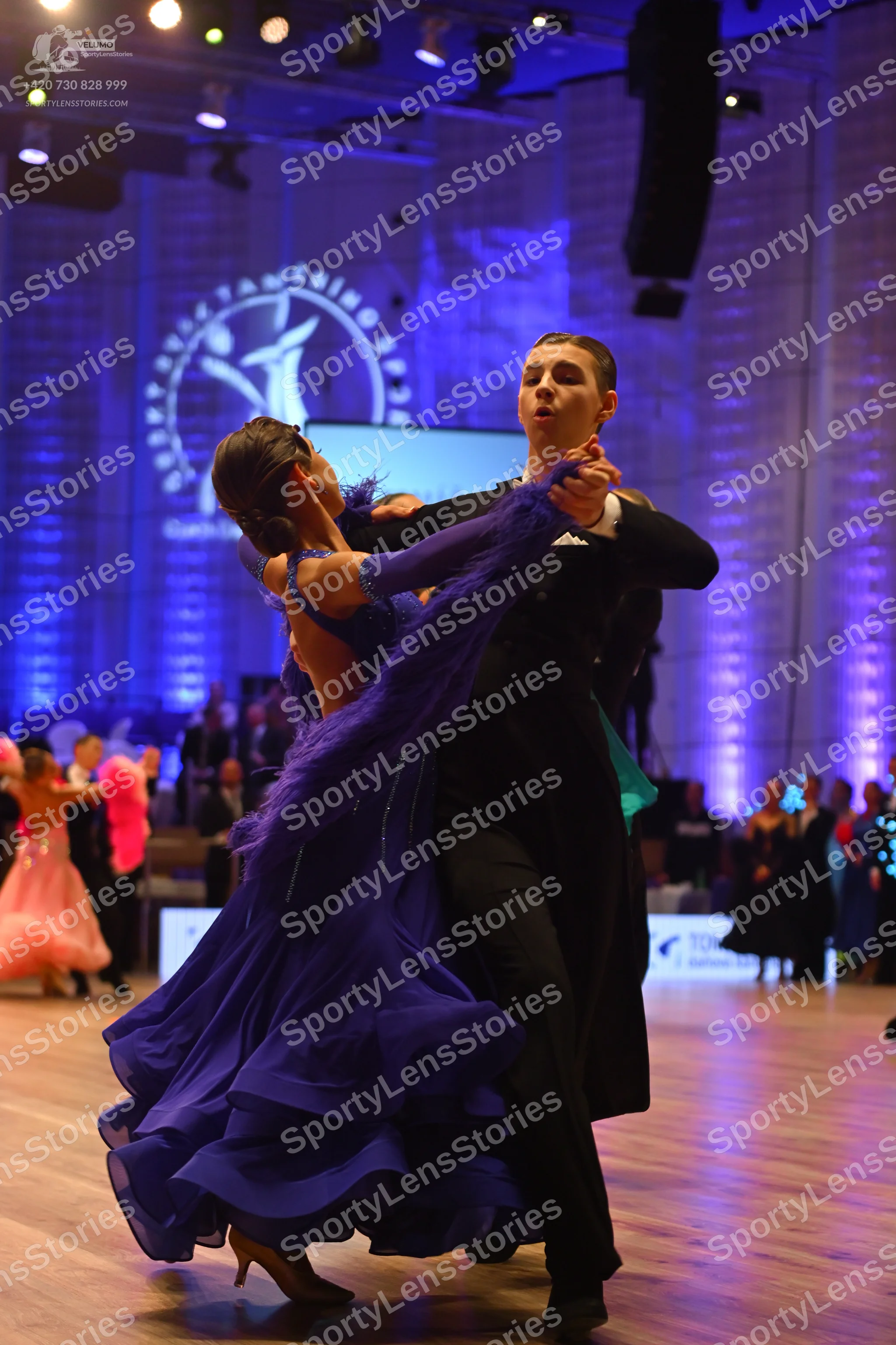 Dancesport competitor: Male dancer: black ballroom suit with a white shirt