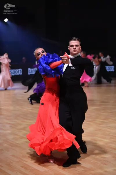 Dancesport competitor: Male dancer: black long-sleeved dance shirt and black trousers