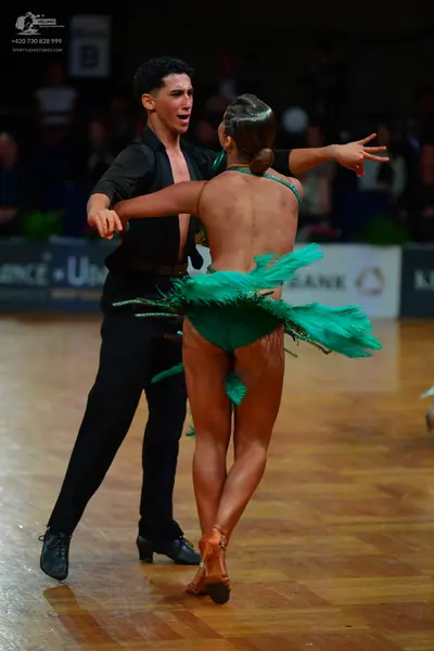 Dancesport competitor: Male dancer: black shirt and black trousers