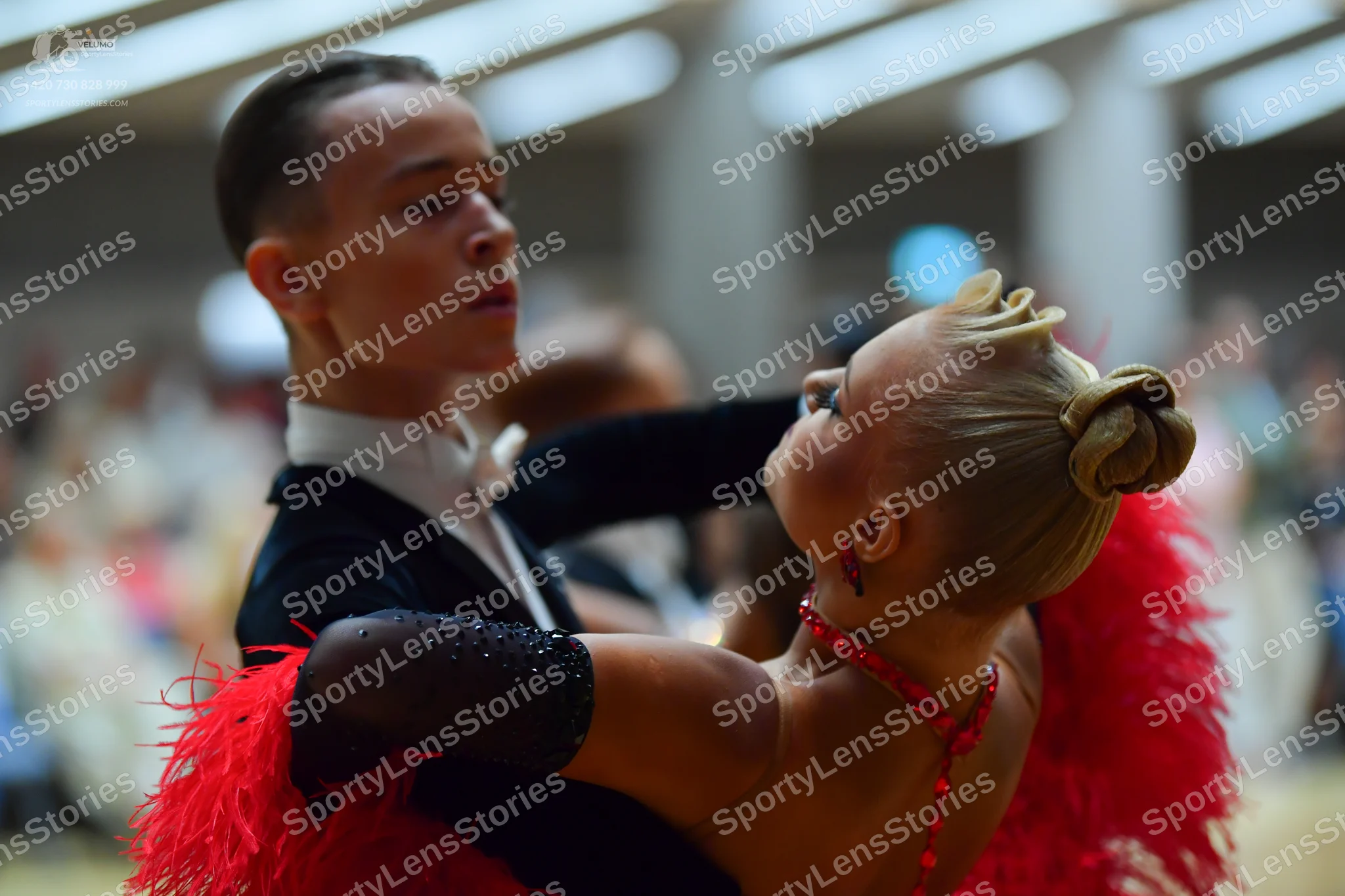 Dancesport competitor: Male dancer: black suit with white shirt and white bow tie