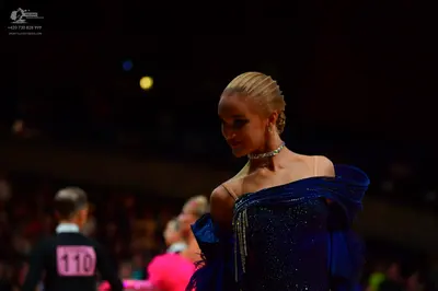 Dancesport competitor: Male dancer: black long-sleeved top
