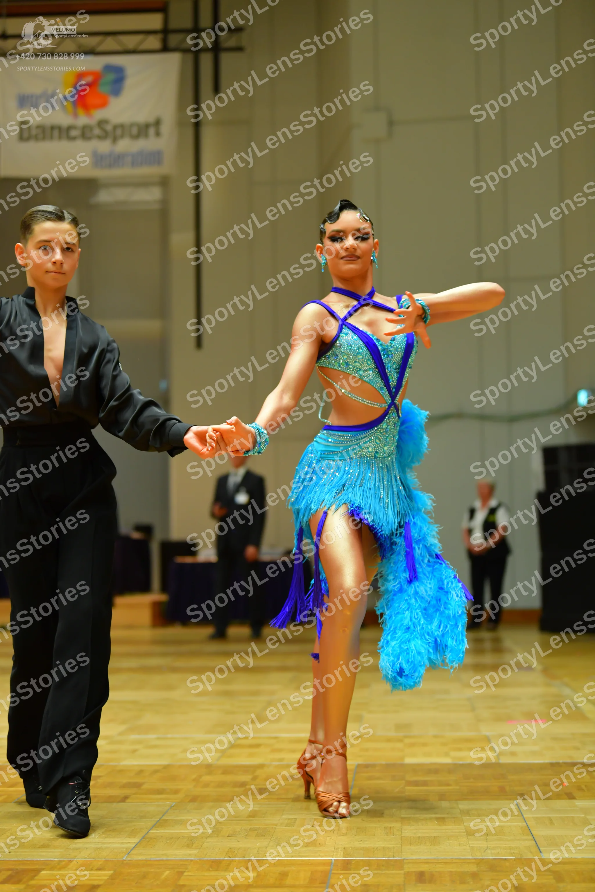 Dancesport competitor: Male dancer: black long-sleeved shirt and black trousers
