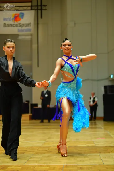 Dancesport competitor: Male dancer: black long-sleeved shirt and black trousers