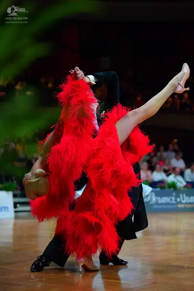 Dancesport competitor: Male dancer: black suit and black dance shoes