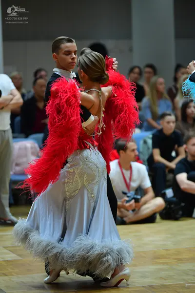 Dancesport competitor: Male dancer: black suit with a white shirt