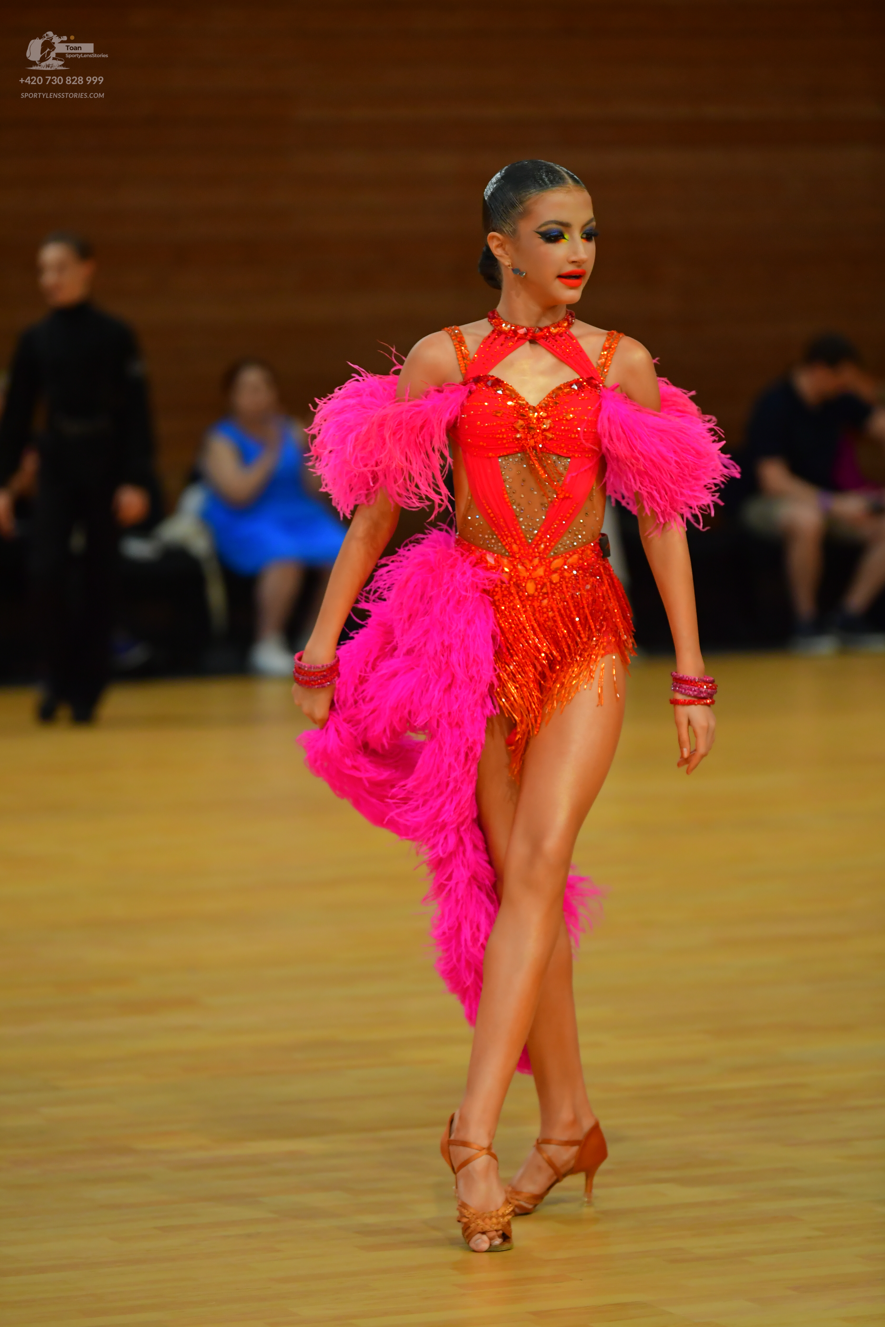 Dancesport competitor: ** Deep red, shimmering latin dress