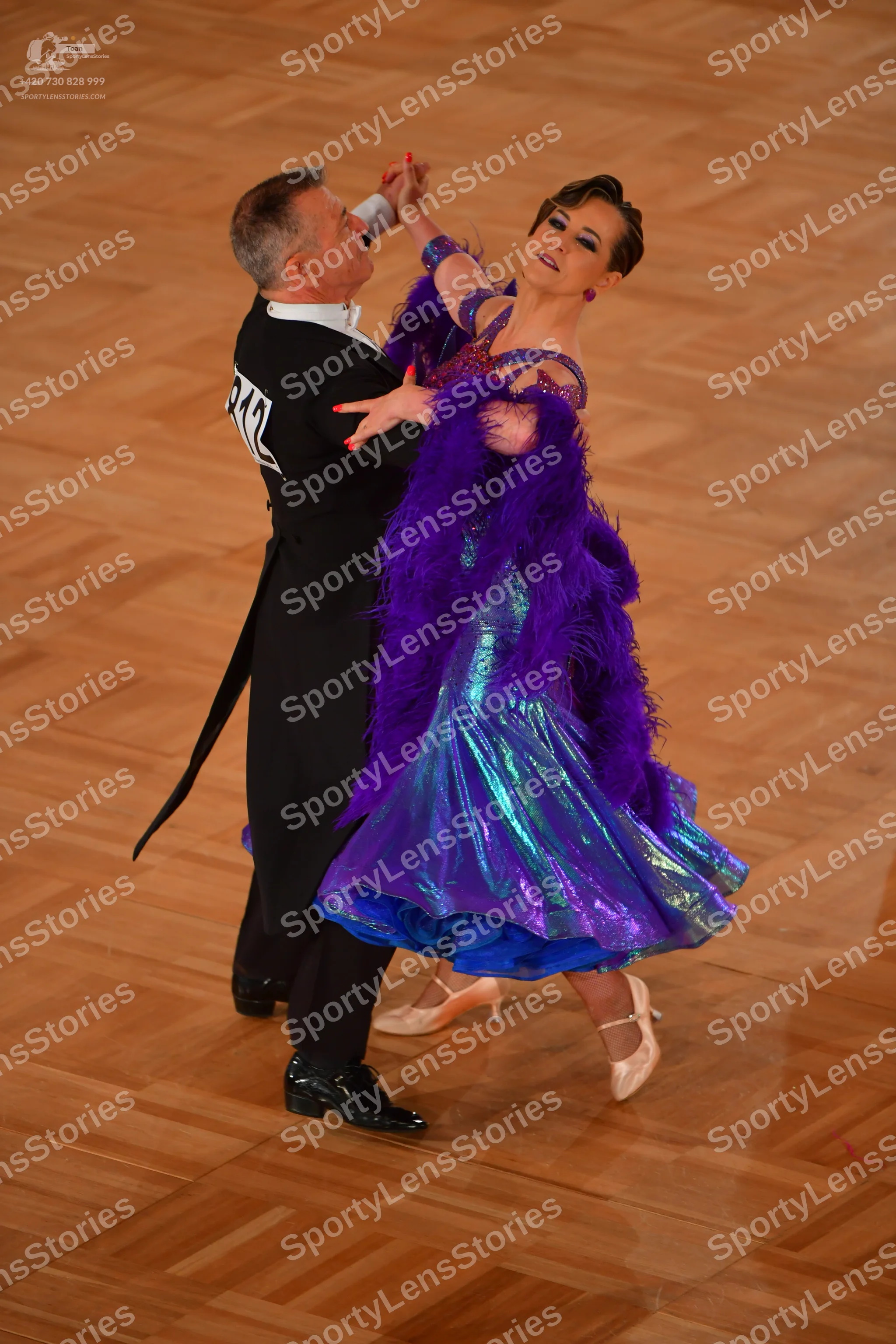 Dancesport competitor #212: Male dancer: black tailcoat with a white shirt and black trousers