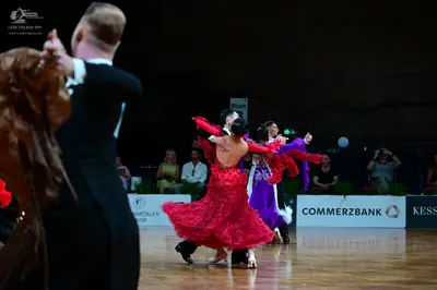 Dancesport competitor: Male dancer: black suit with white shirt and bow tie