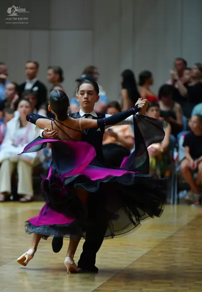 Dancesport competitor: Male dancer: black suit with a white shirt and black bow tie