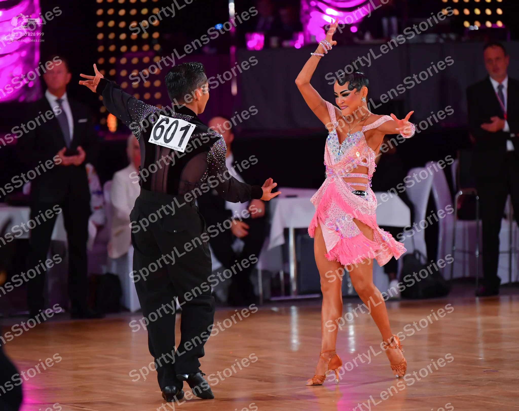 Dancesport competitor #601: Male dancer: black long-sleeved top with shimmering/sequin details and black tro