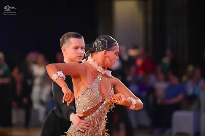 Dancesport competitor: Male dancer: black long-sleeved shirt