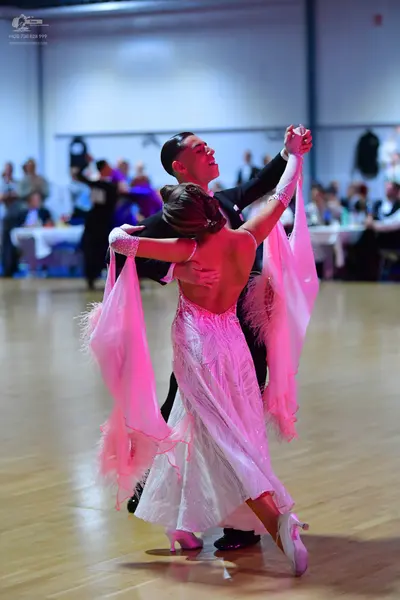 Dancesport competitor: Male dancer: black suit