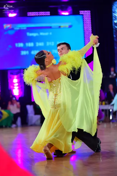 Dancesport competitor: Male dancer: black suit