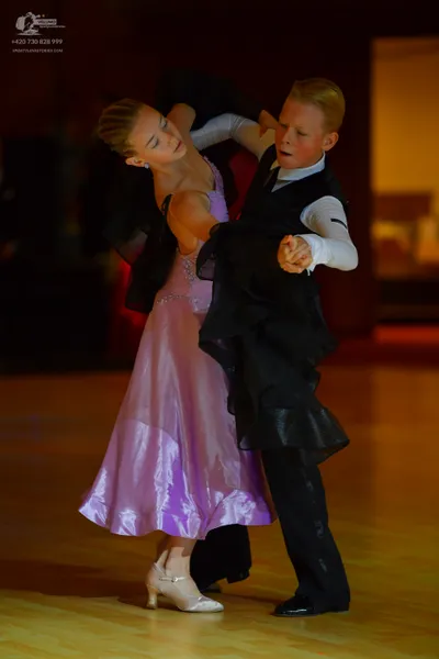 Dancesport competitor: Female dancer: light purple satin ballgown