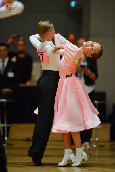 Dancesport competitor #27: Male dancer: white long-sleeved shirt and black trousers