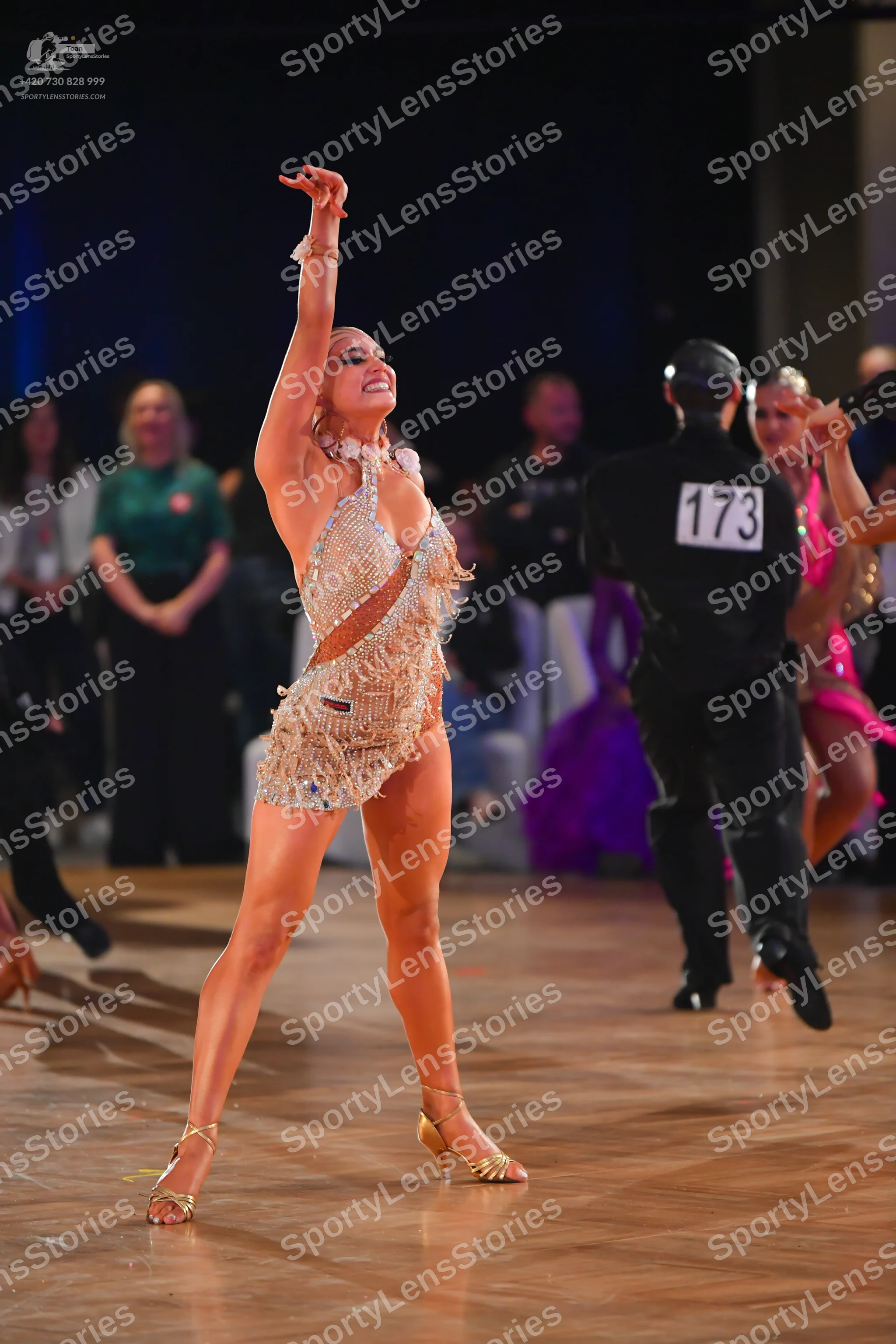 Dancesport competitor #173: Female dancer: champagne-colored latin dance bodysuit with sequins and fringe, a