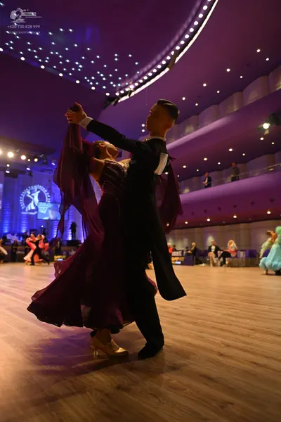 Dancesport competitor: Male dancer: black tailcoat with a white shirt