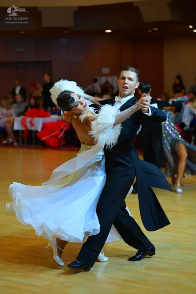 Dancesport competitor: Male dancer: black tailcoat suit with a white shirt and white bow tie
