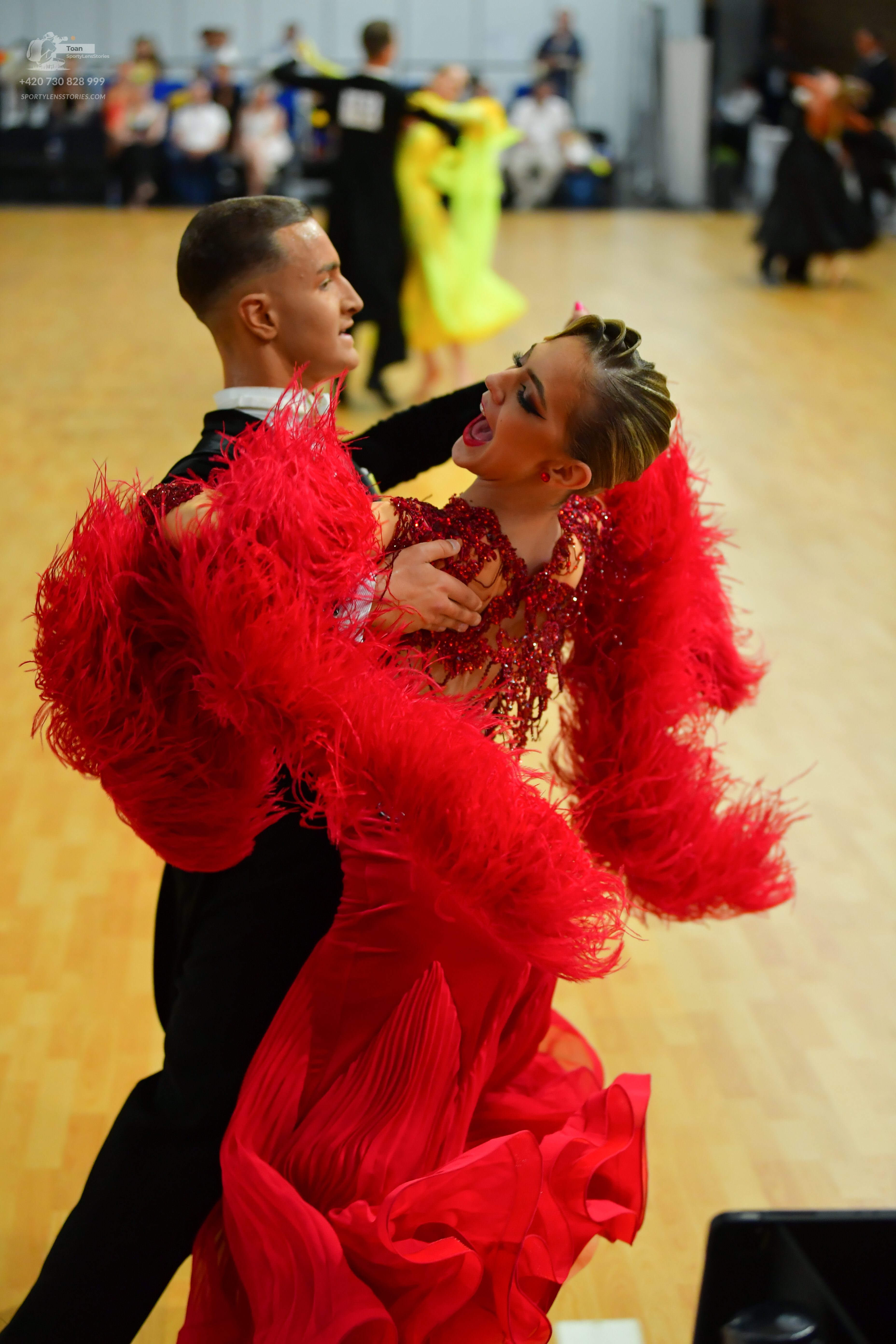 Dancesport competitor: ** Black tailsuit
*   **Fabric:** Likely satin or a similar smooth fabric based 